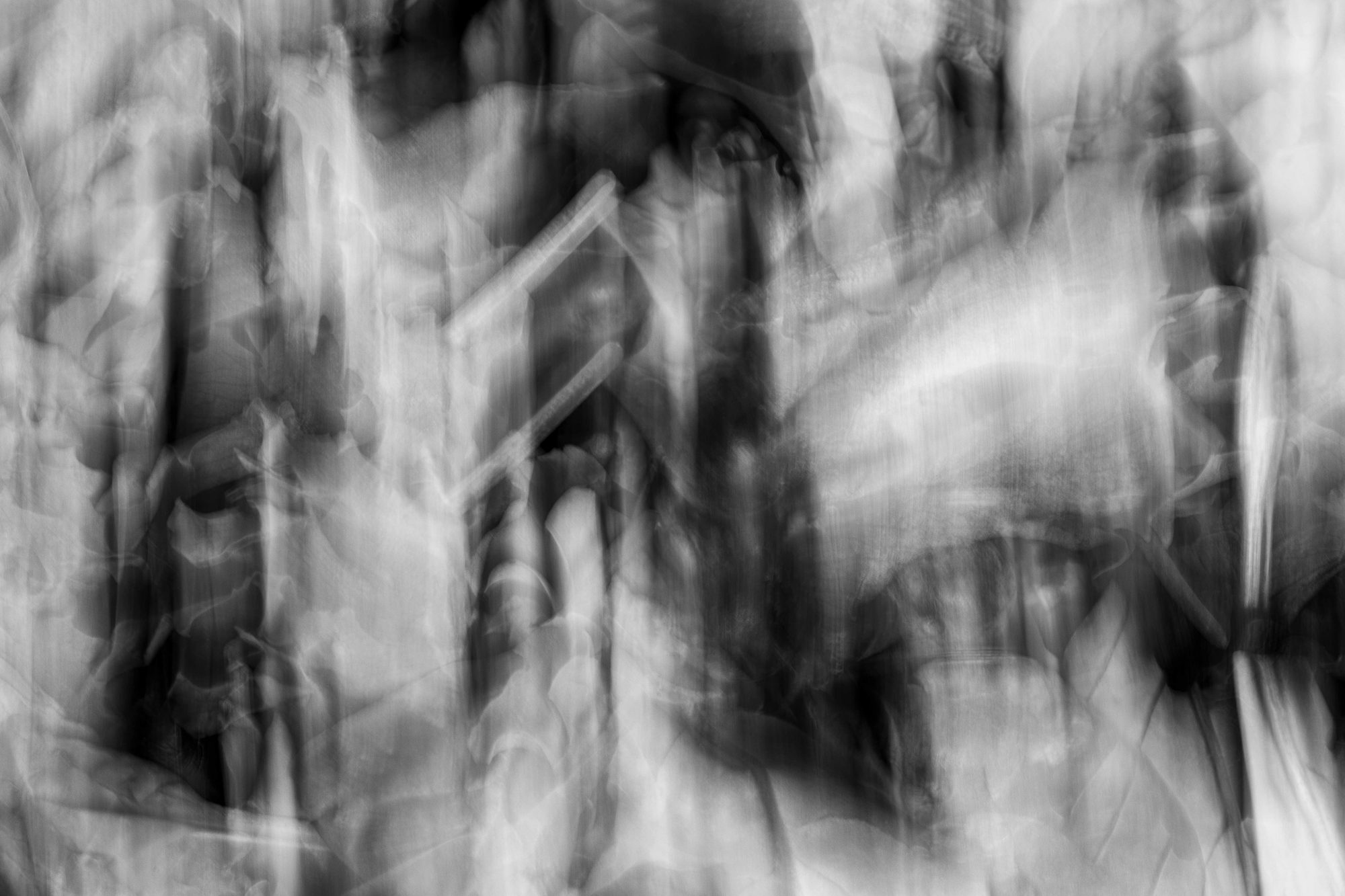 Black and white vertical forms like a blurred cathedral interior